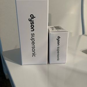 Dyson supersonic gentle air and dyson supersonic wide tooth comb attachment.